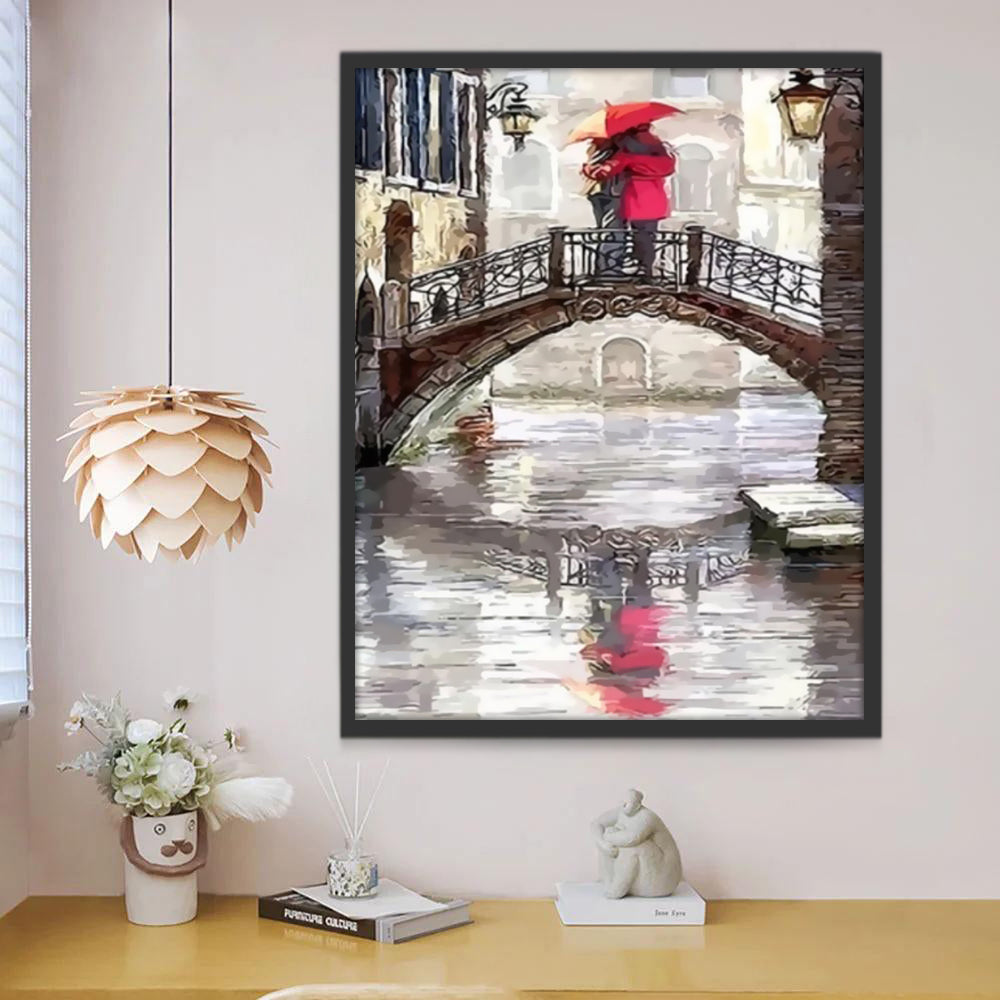 Paar Knuffelen met Rode Paraplu's op de Brug Schilderen op Nummers